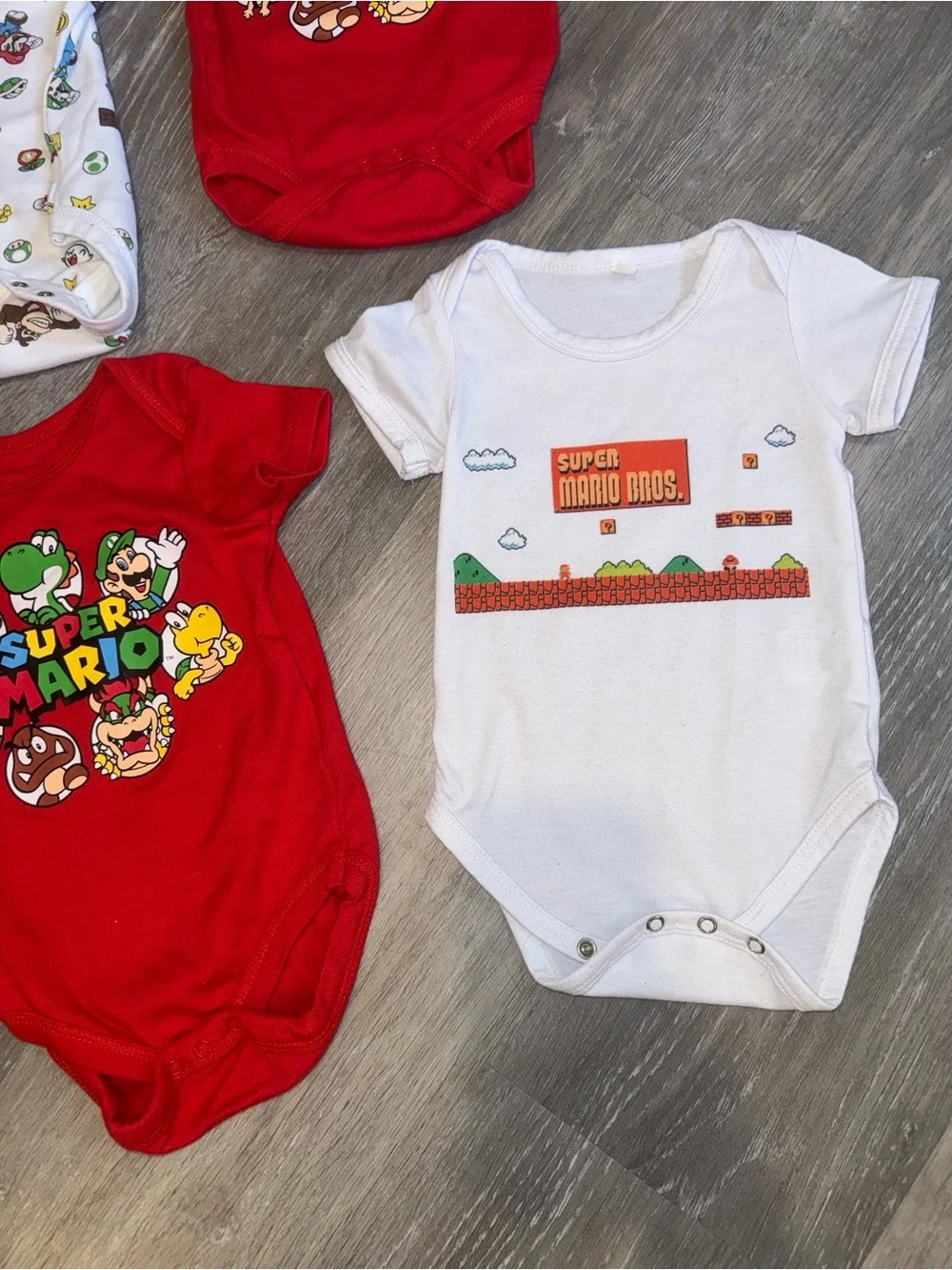 Super Mario baby onesies